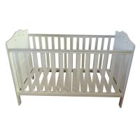 White cot bed with balls